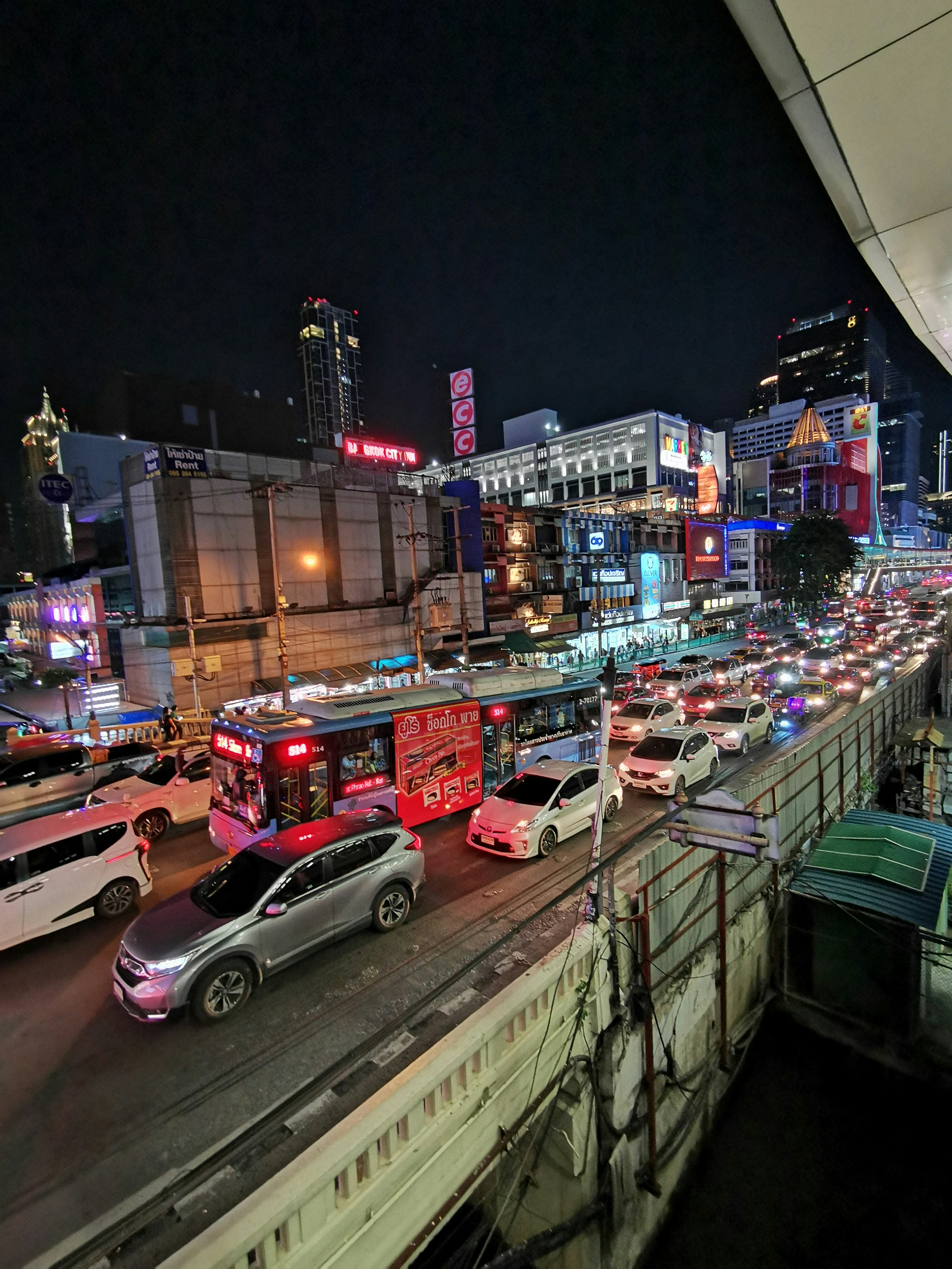 Bangkok traffic at night near Platinum Fashion Mall.