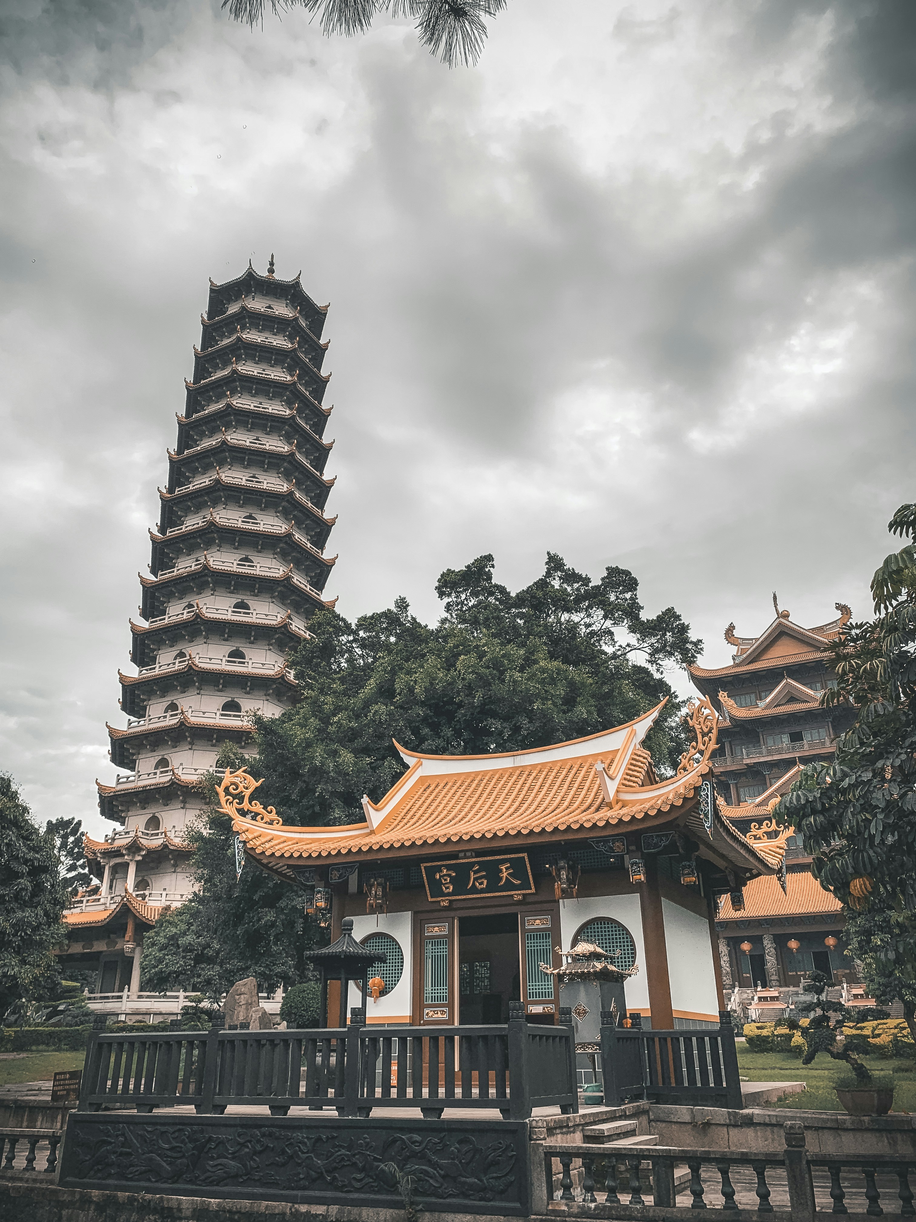 orange and white temple under white and gray sky