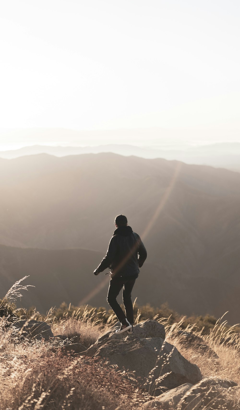 person standing on rock