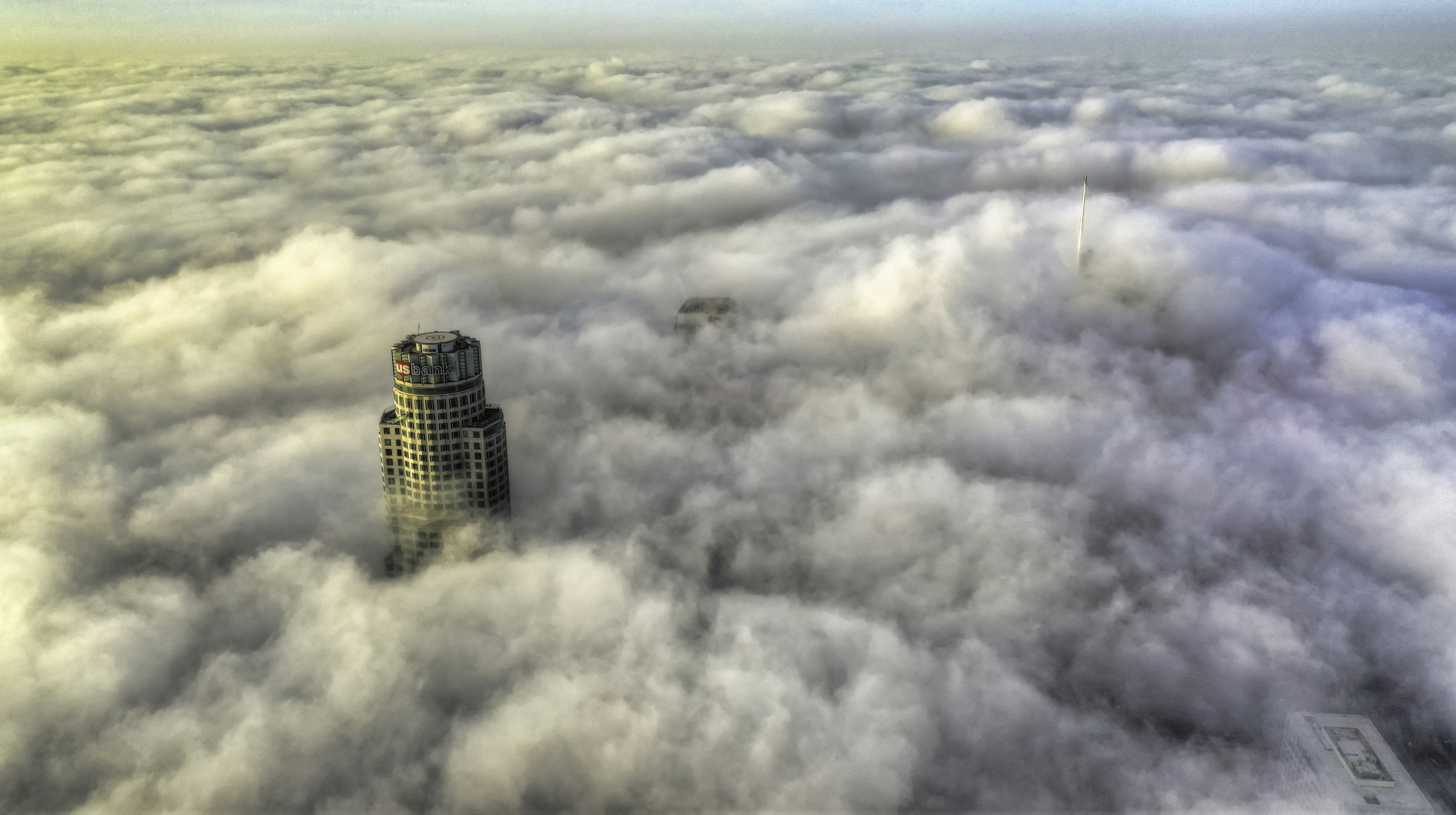 High-rise building beside clouds photo – Free City Image on Unsplash