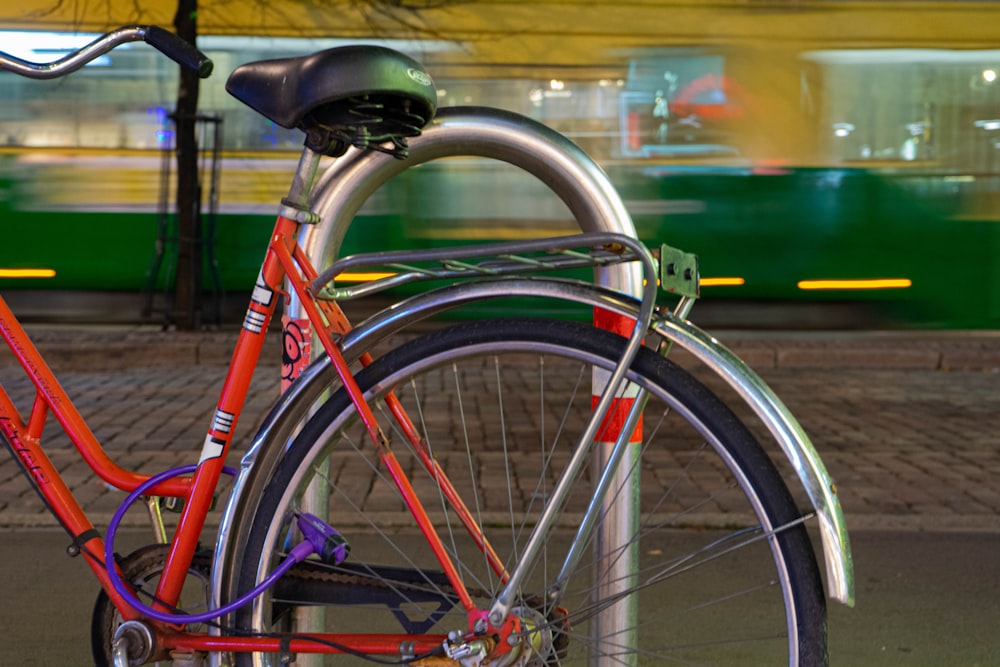 red bike parked on coral during daytime