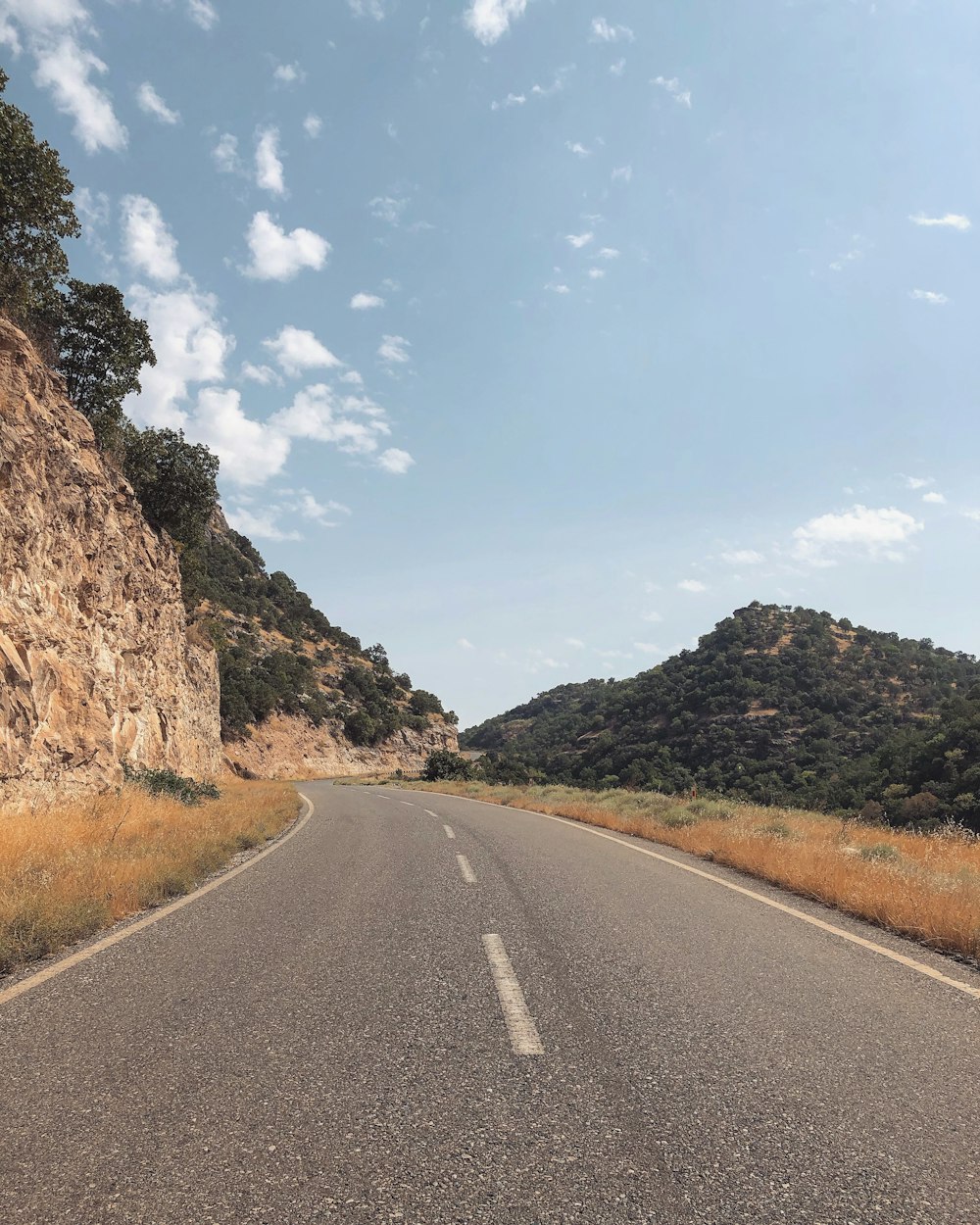 view photography of black top road