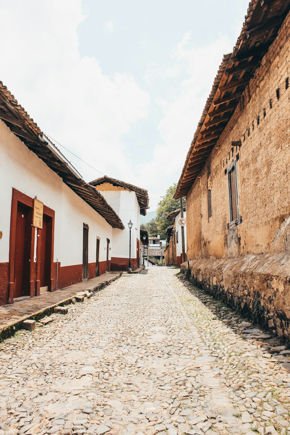 a cobblestone street in a small village