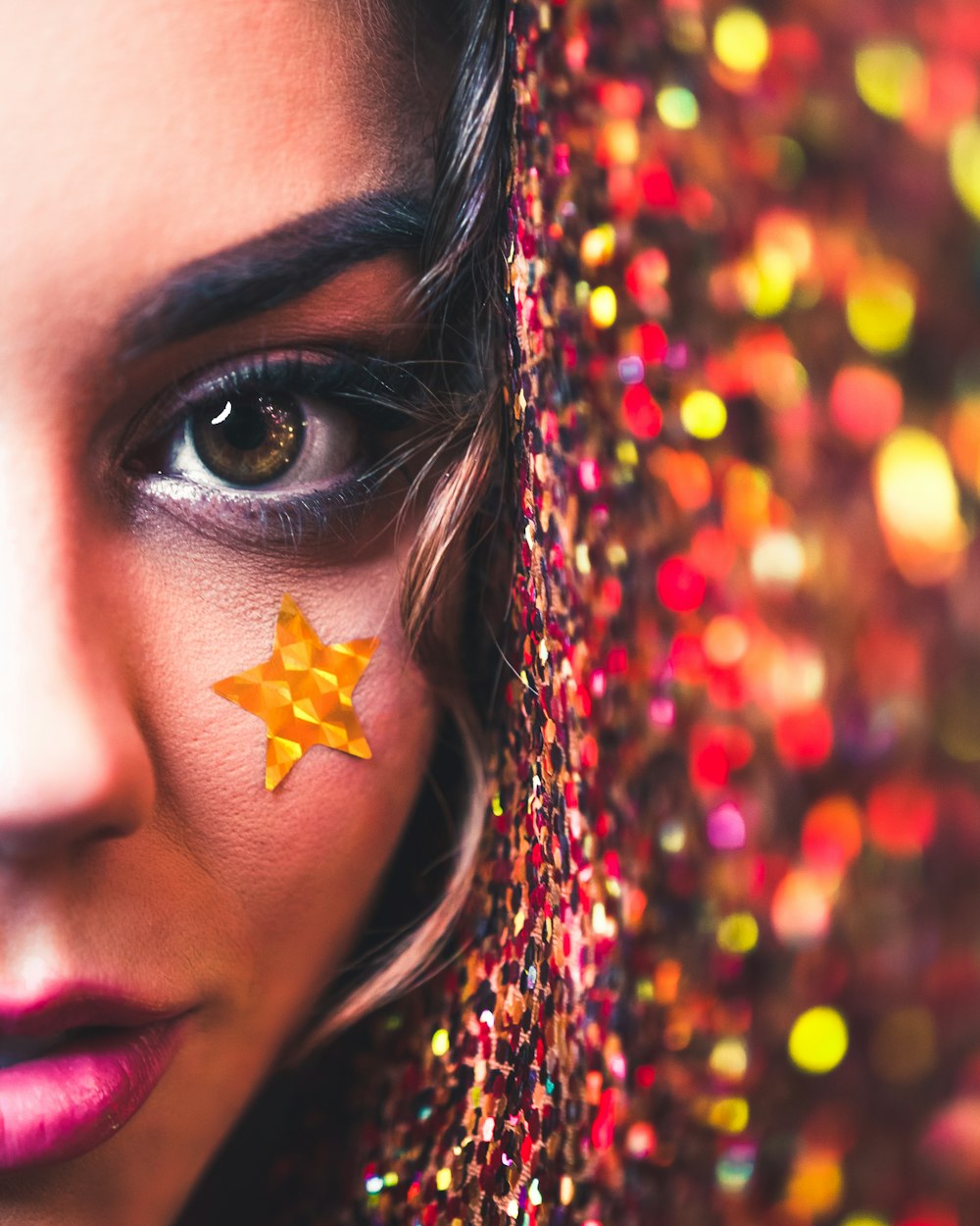 selective focus photography of woman with sticker under eye