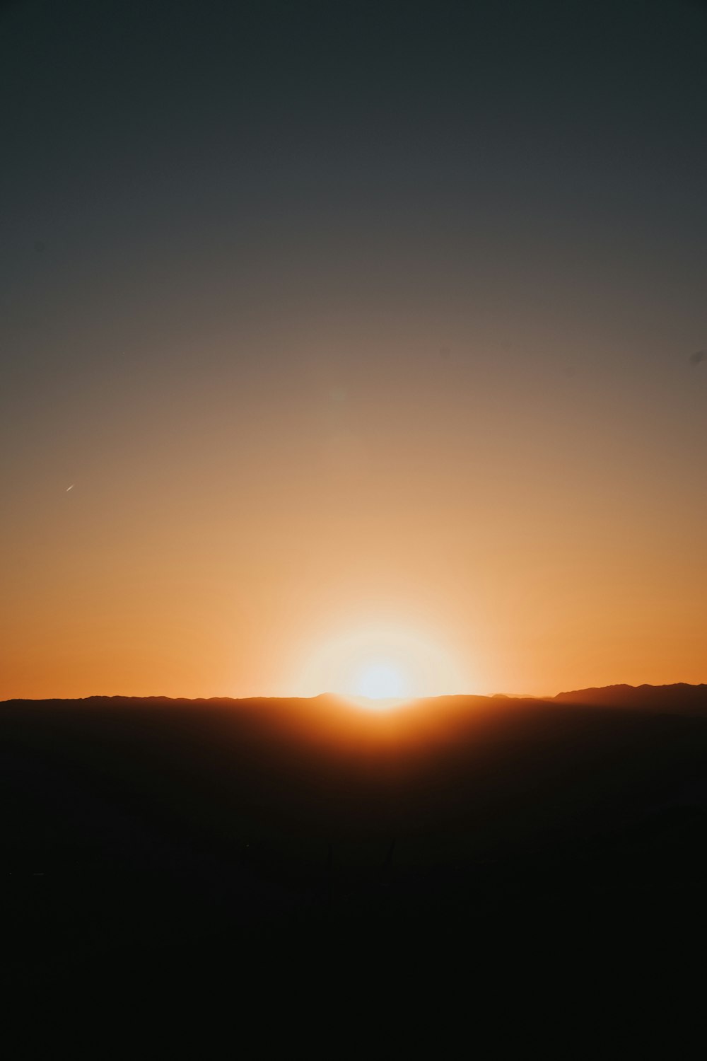 silhouette of mountain during golden hour