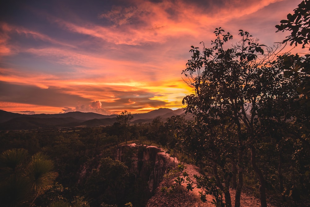 aerial photography of mountain under orange and yellow sky