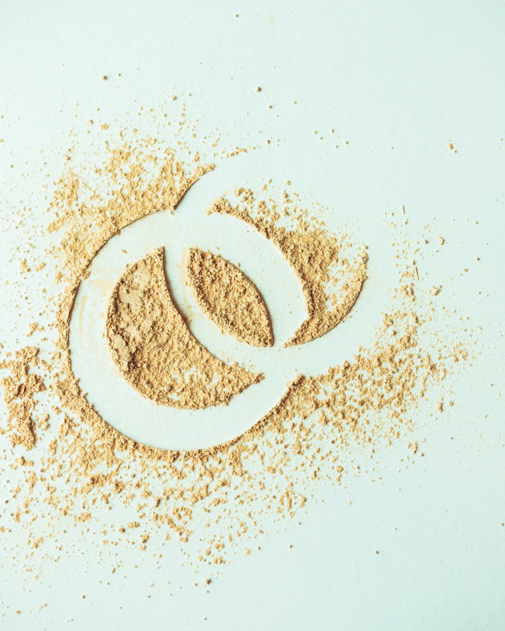 a pile of sand with two rings drawn in it