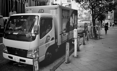 A delivery truck parked in a city area.