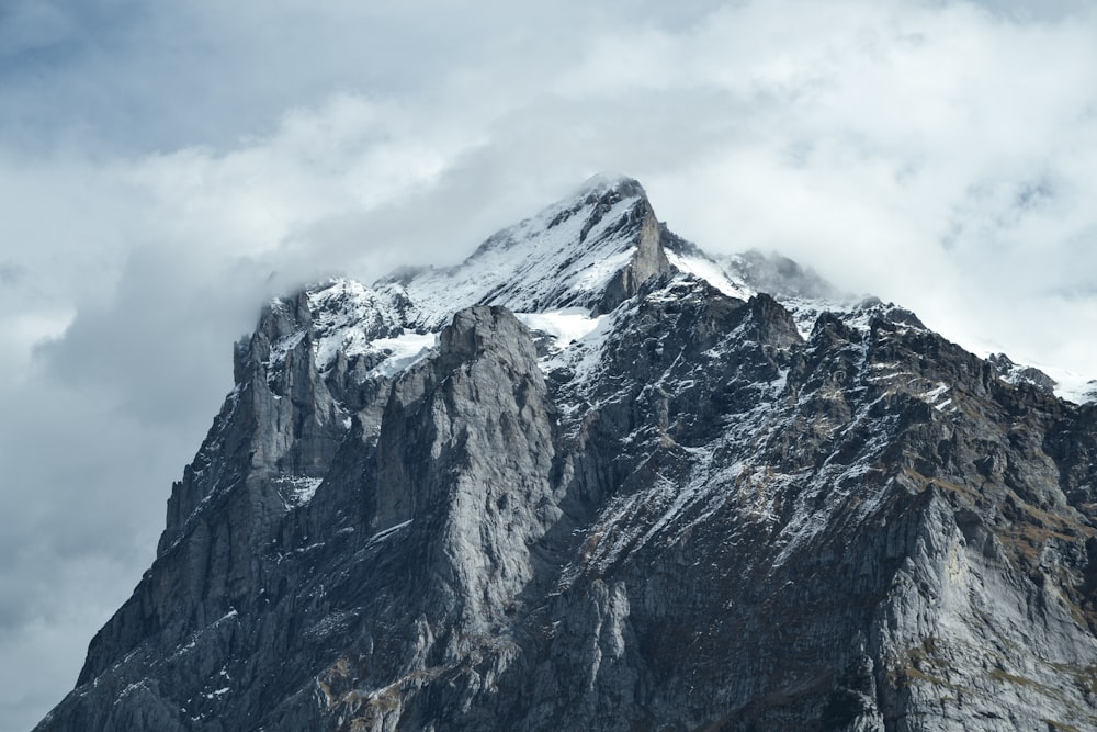 summit of mountain under white and blue sky