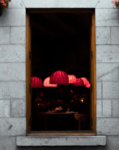 Cozy interior of Qasr Lahm steakhouse with dim lighting and guests enjoying meals.