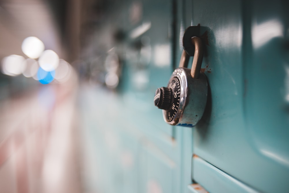 selective focus photography of gray metal padlock