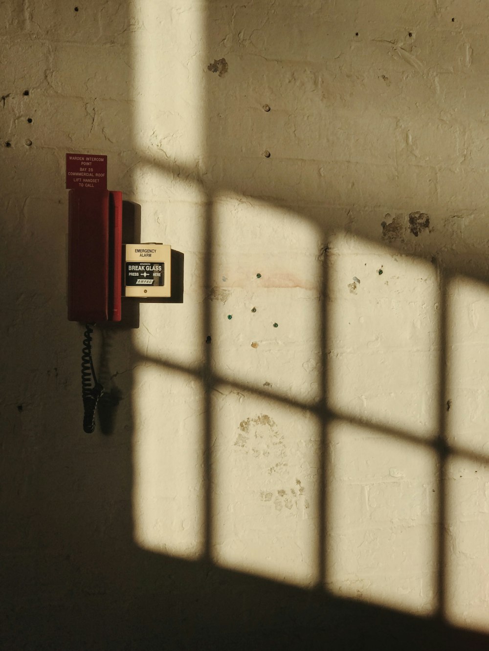 red wall phone on wall