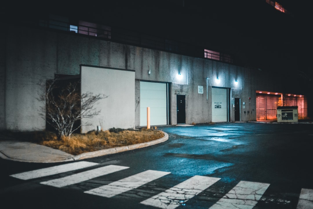 lighted gray building facing pedestrian