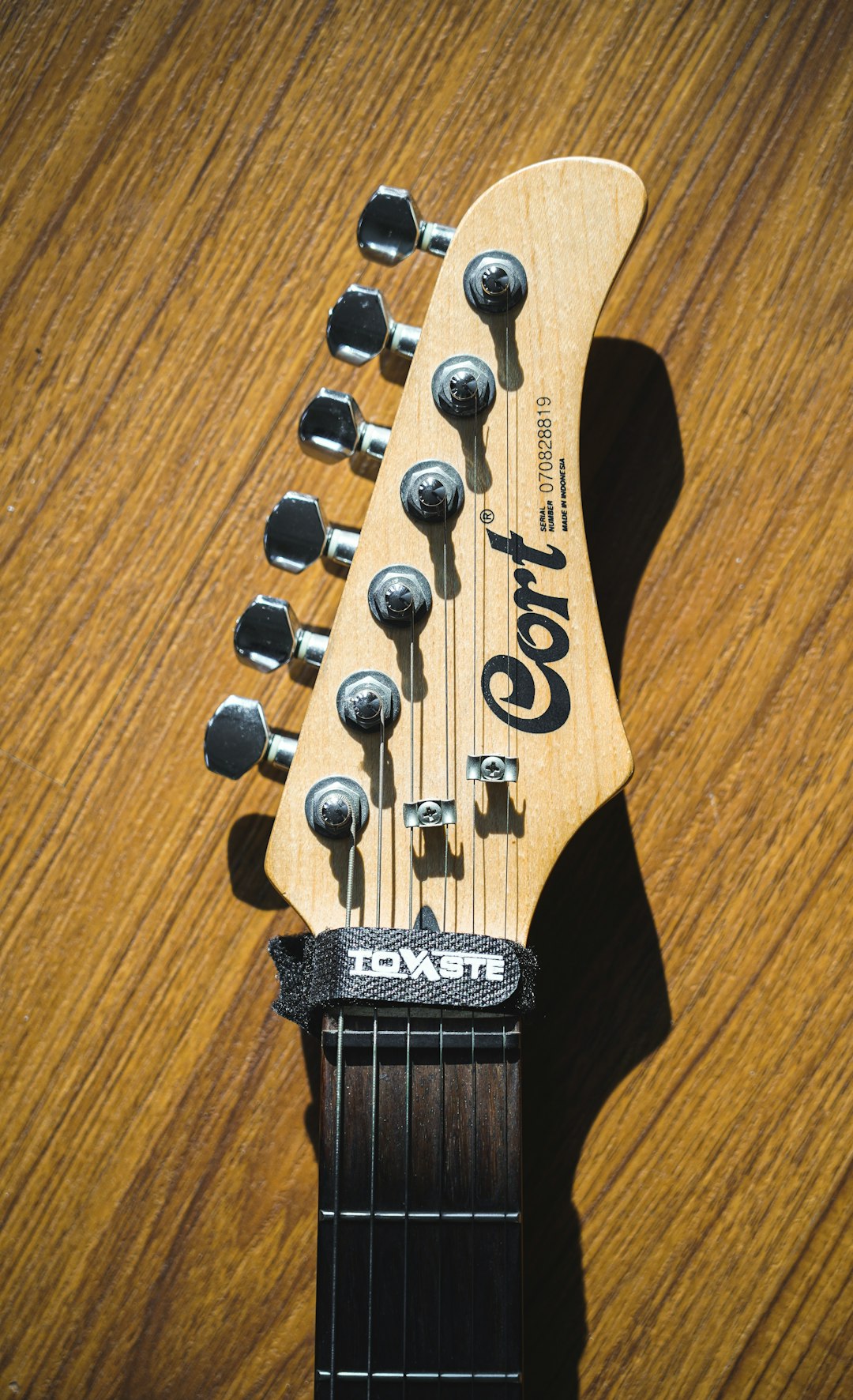 brown Cort guitar headstack