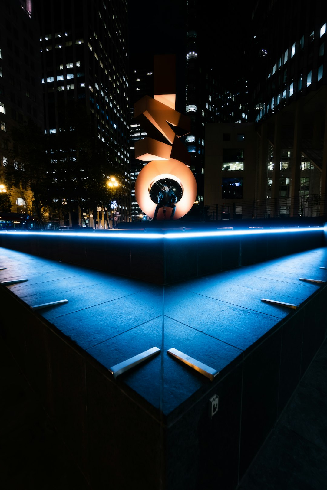 lighted blue building at night