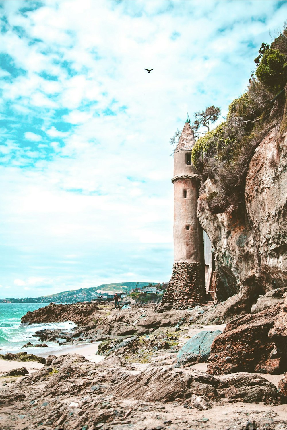 beige concrete lighthouse during daytime