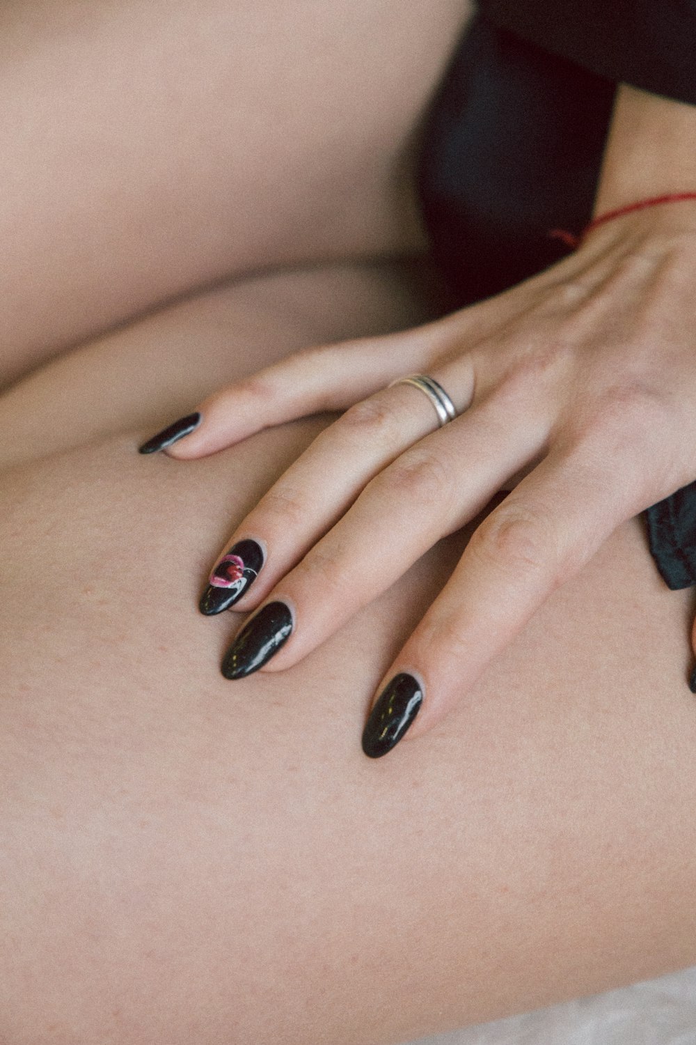 woman wearing silver-colored ring