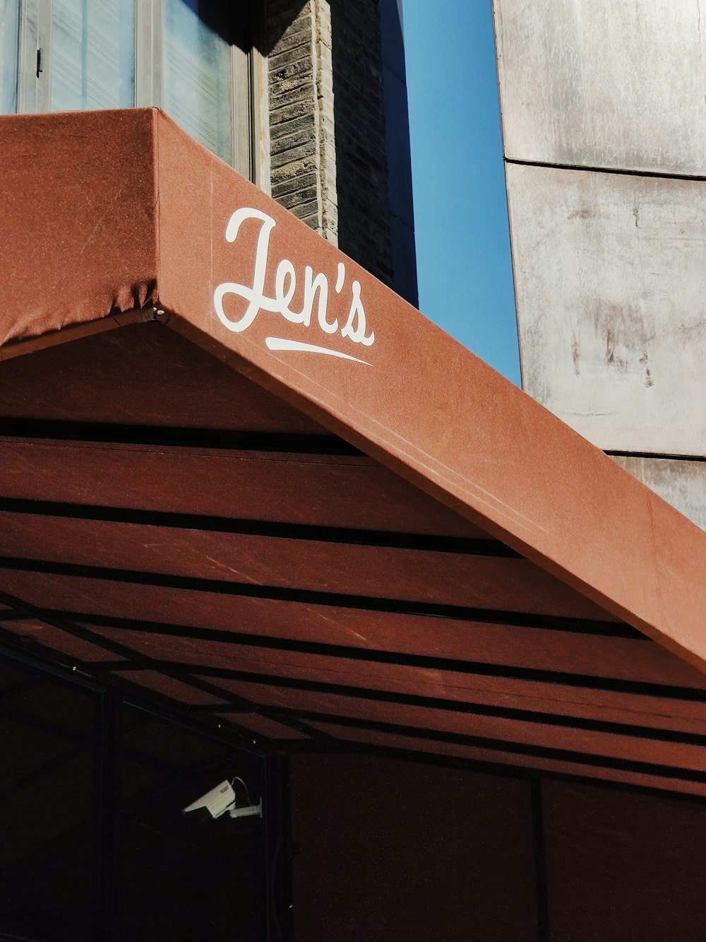 red Jen's awning during daytime