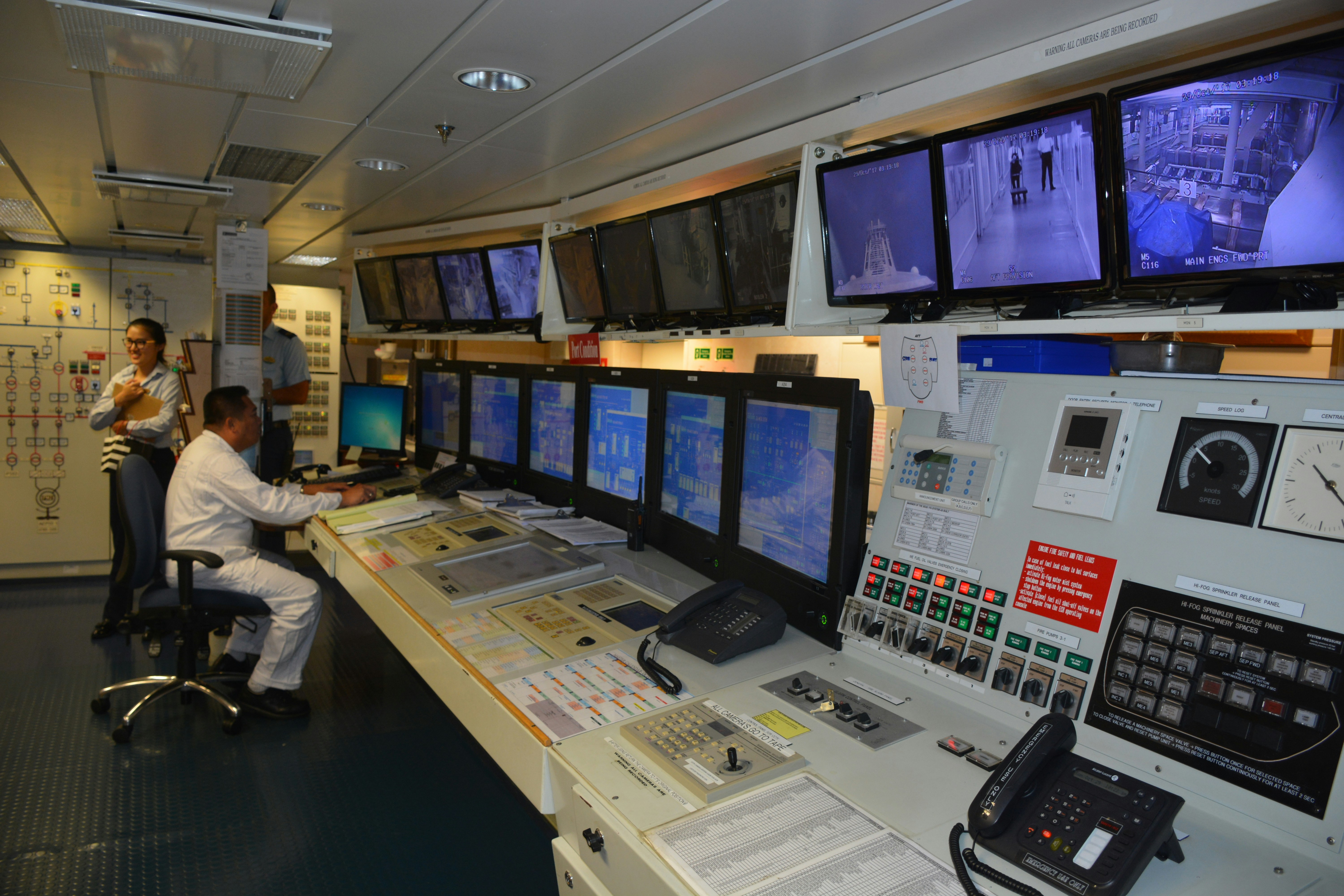 Advanced cybersecurity command center with multiple monitors displaying security analytics and threat detection systems