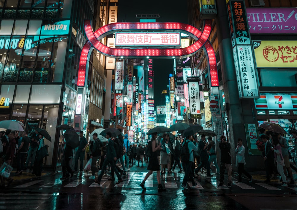 people walking beside building during daytime