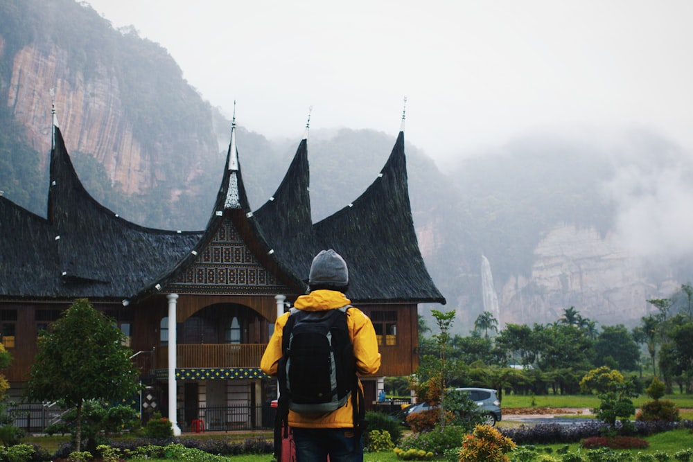 man carrying backpack