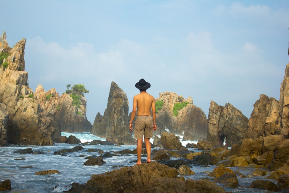 man standing on rock