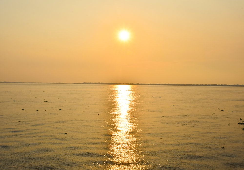 body of water during golden hour