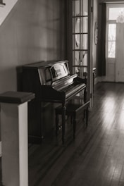brown wooden upright piano