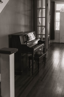 brown wooden upright piano