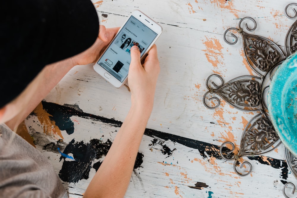 person holding white Android smartphone