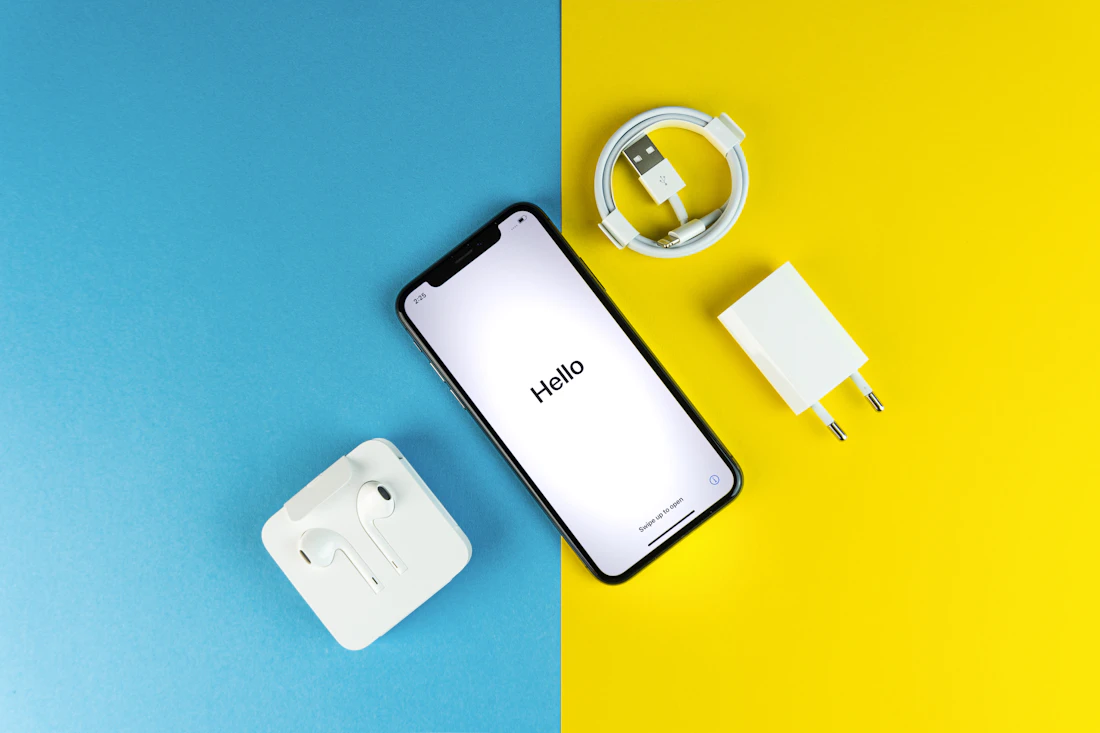 Phone accessories — chargers, cables and earphones laid out at Fone Case Camborne