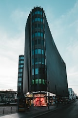 grey and teal high-rise building