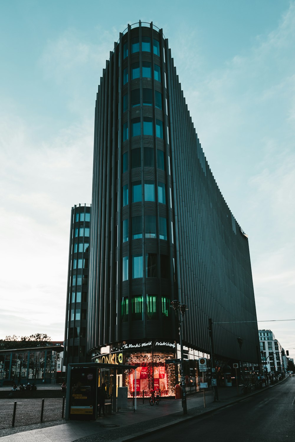grey and teal high-rise building