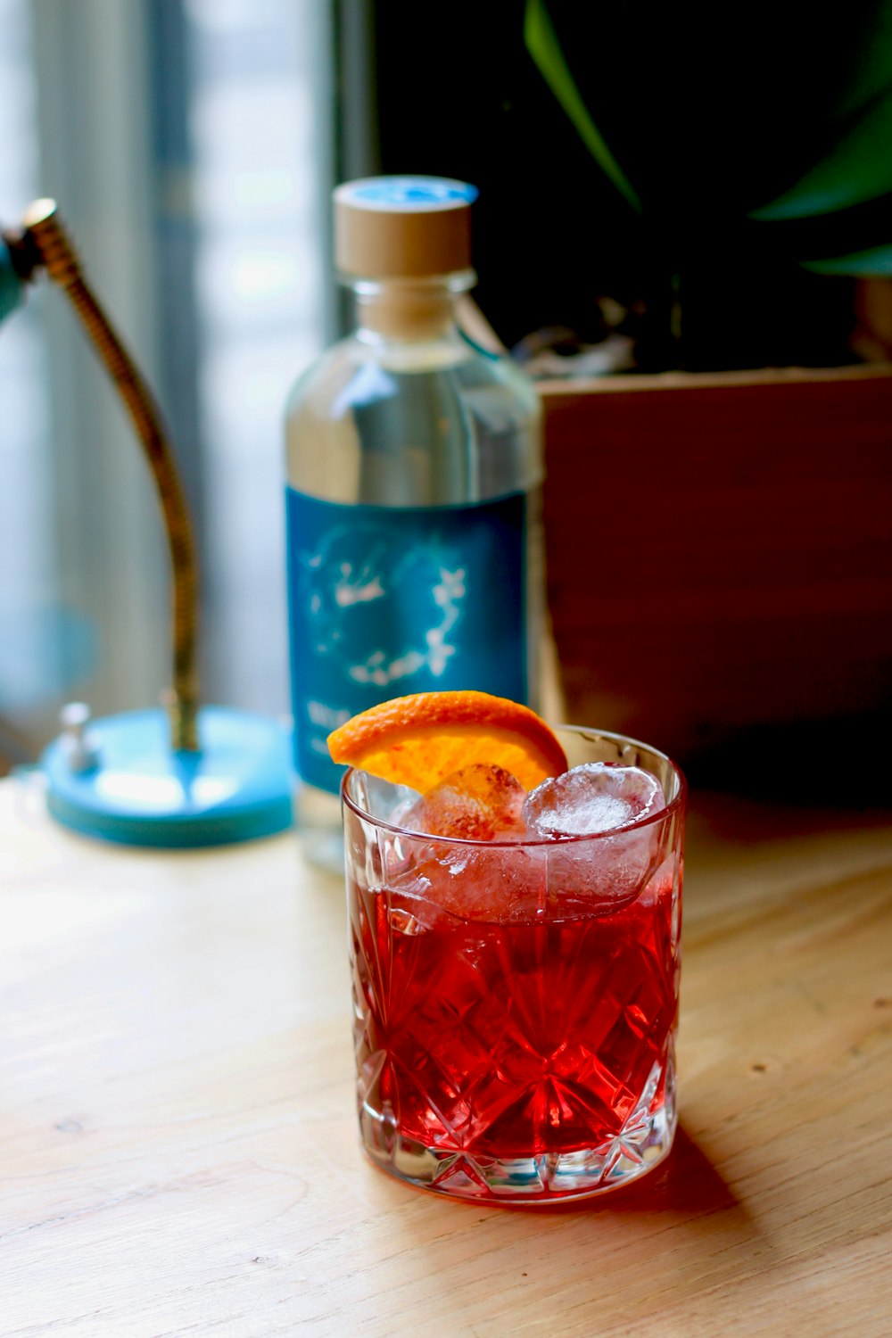 red liquid in clear drinking glass