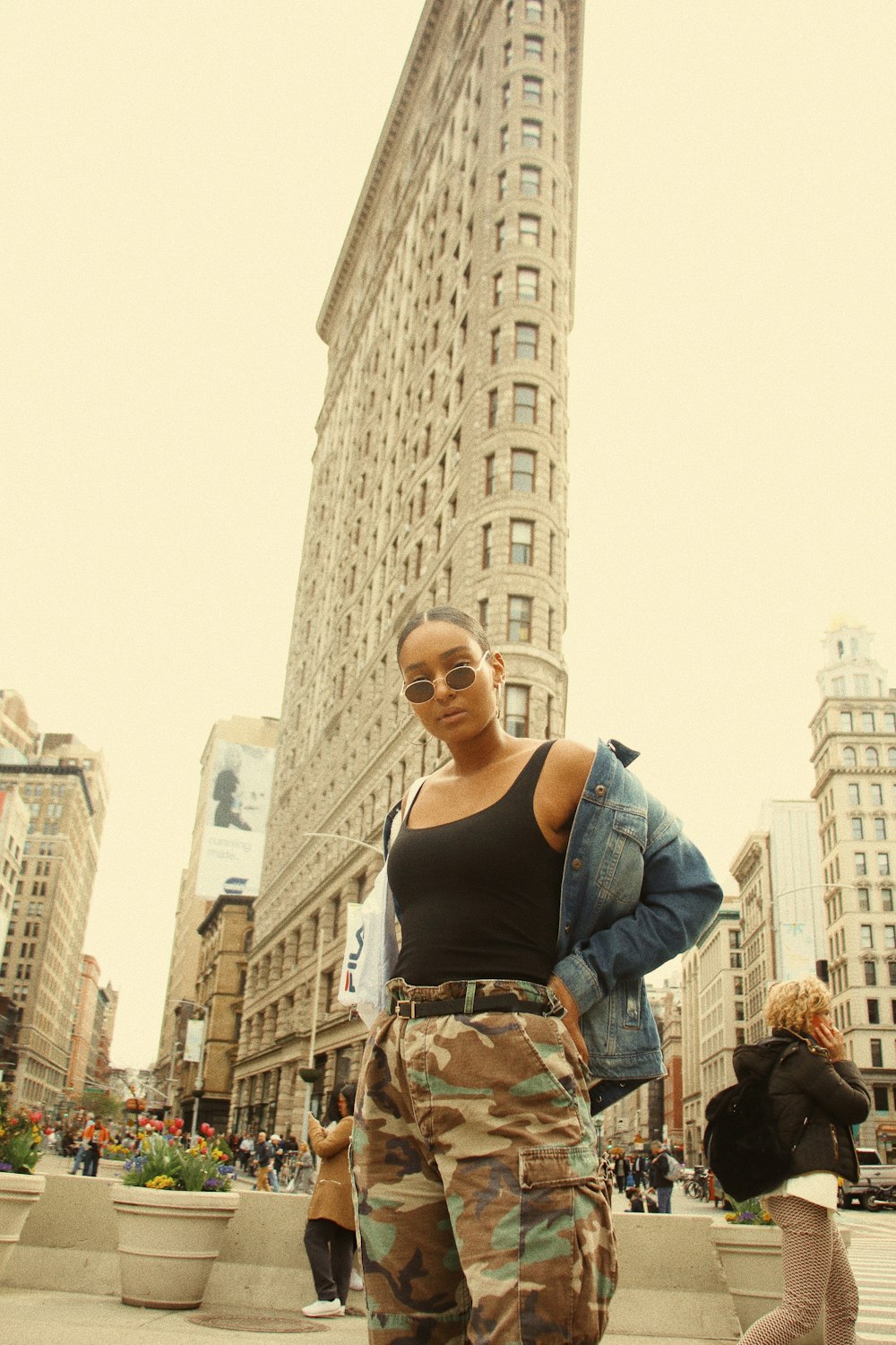 woman standing near Flatiron building during daytime