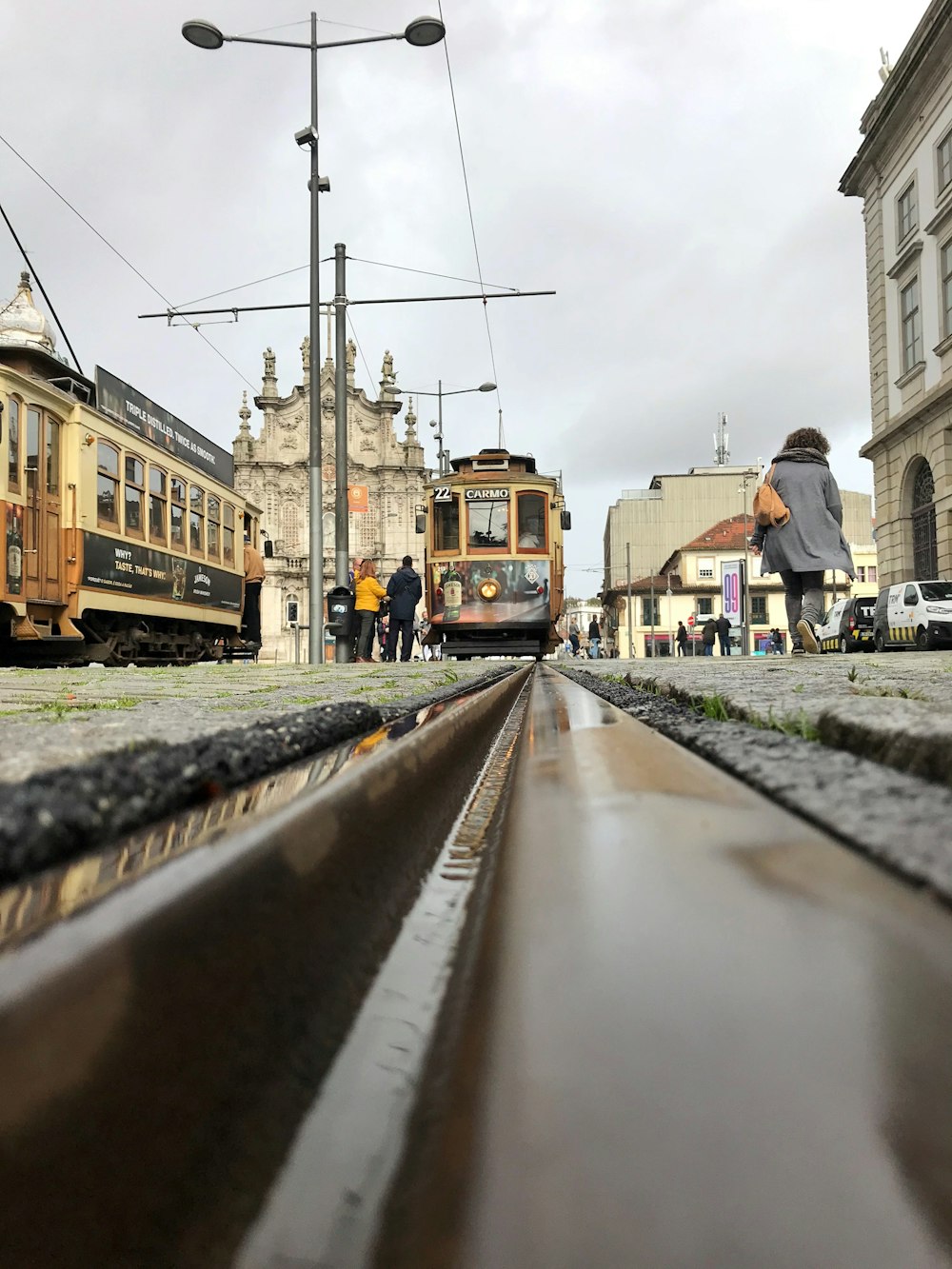 orange metal tram on road during daytime