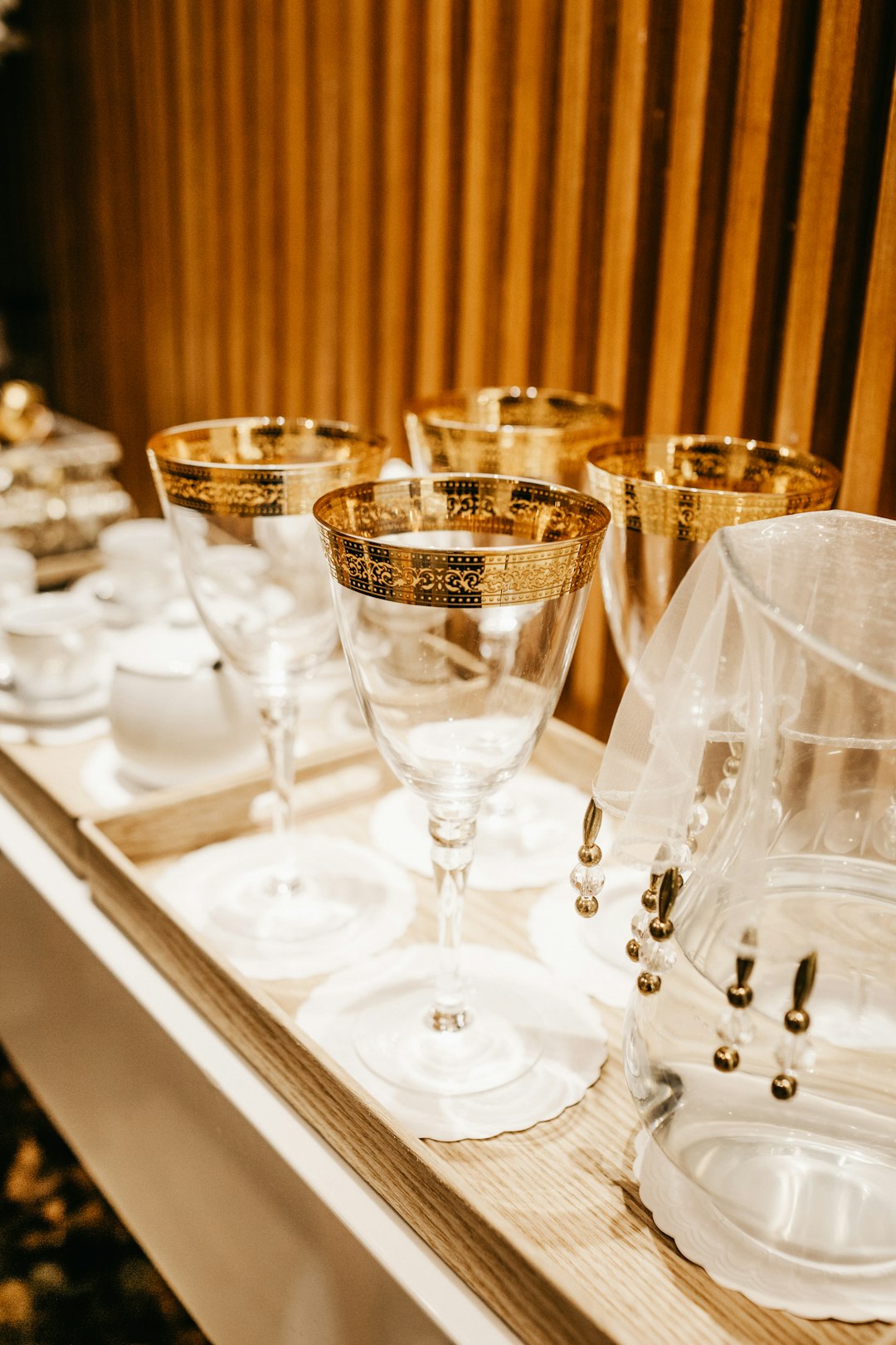 shallow focus photo of clear footed wine glasses