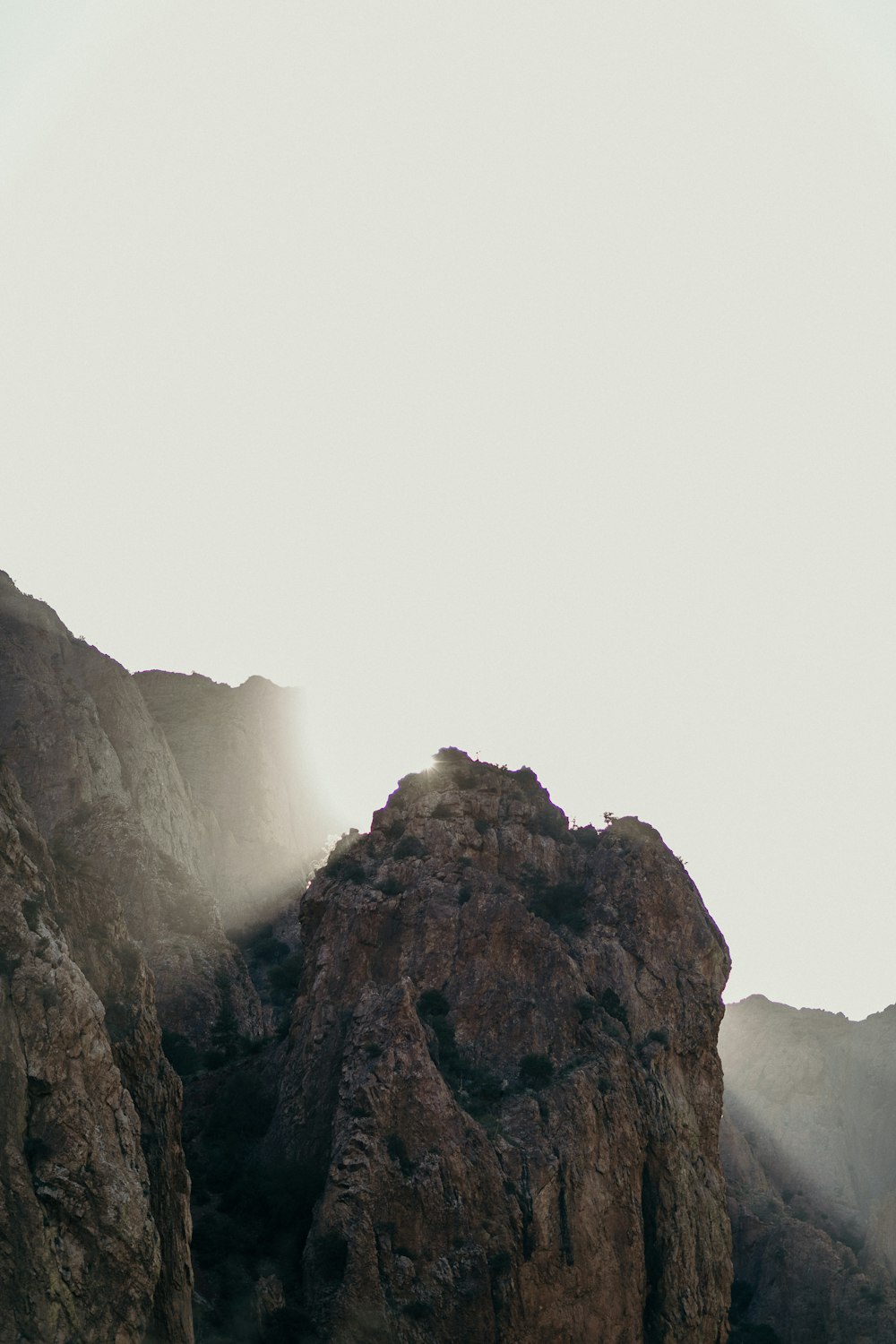 mountains under cloudy sky during daytime