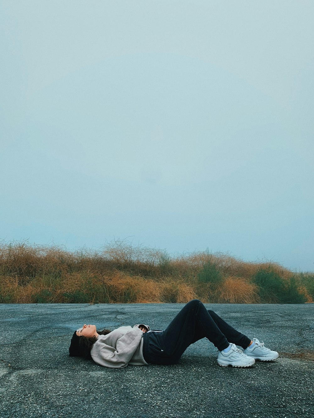 woman lying on road