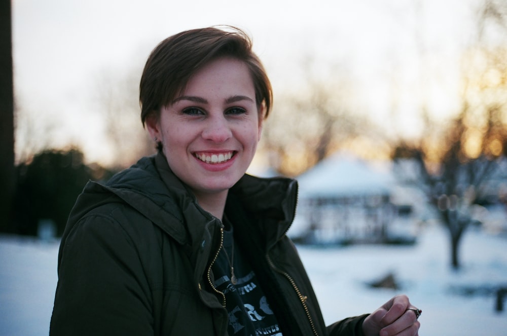 woman in green jacket