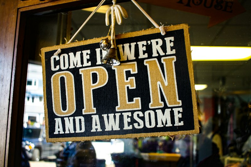 Shop sign that says come in we are open