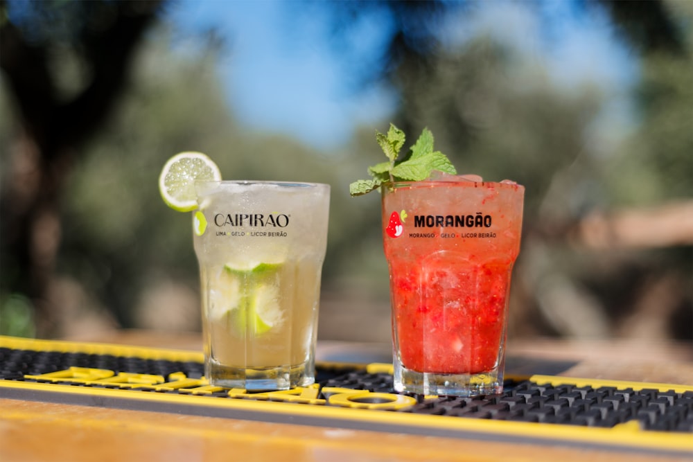 shallow focus photo of two clear drinking glasses