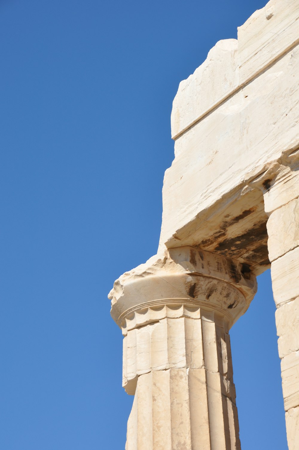 a close up of a column with a blue sky in the background