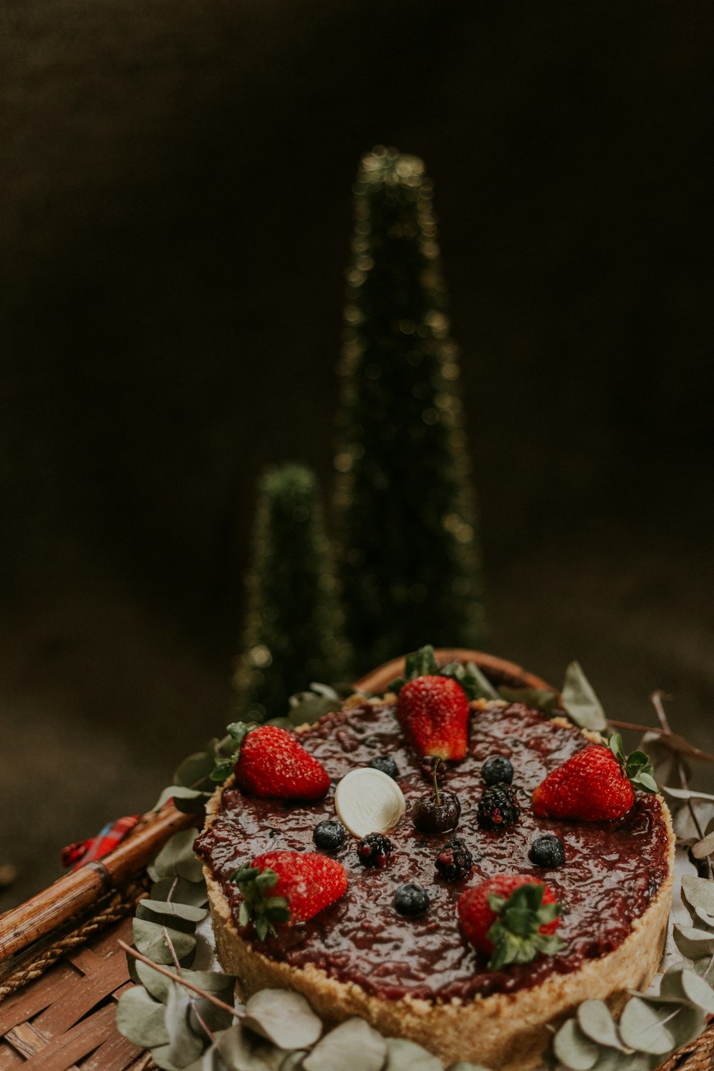 a cake with strawberries and berries on top of it