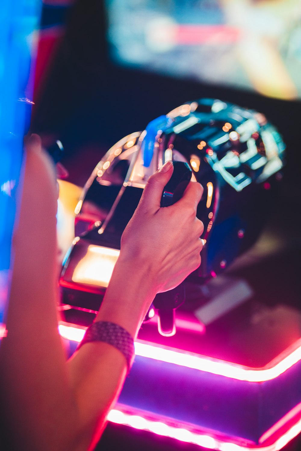 woman playing arcade game