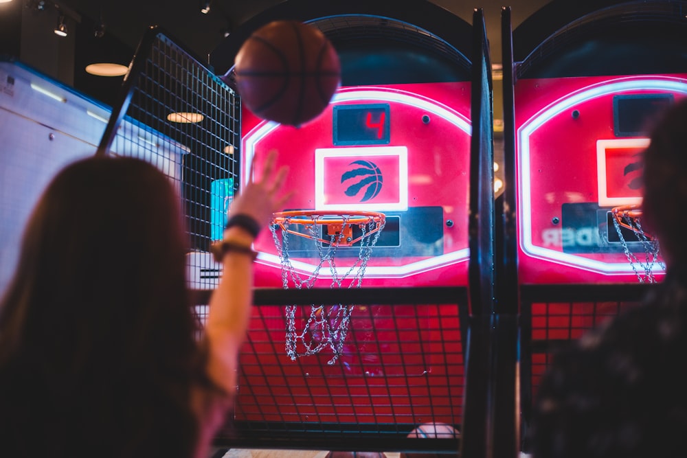two person playing basketball arcade games