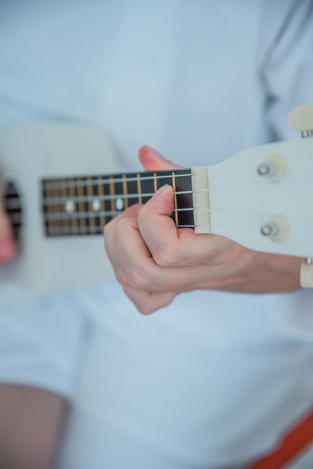 person playing ukulele