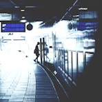 A serene shot of travelers boarding a sleek Shinkansen train at dawn.