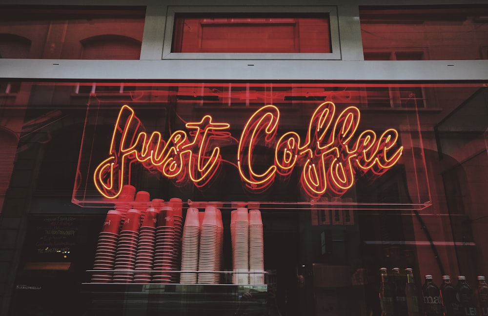Just Coffee neon sign at night