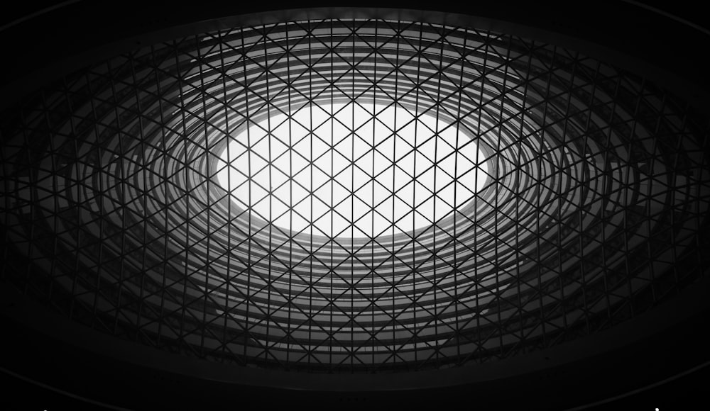 a round window in a building with bars on it